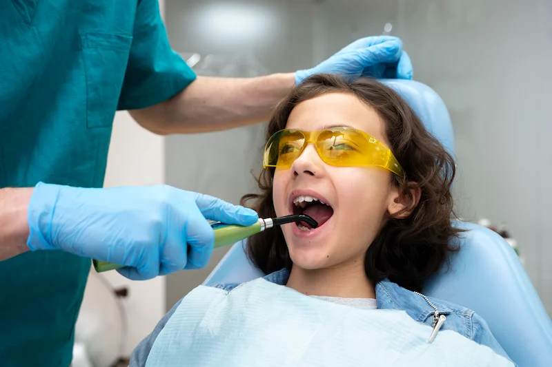 close up boy dentist